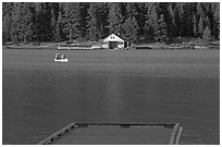 Dock, canoe, and boathouse, Maligne Lake. Jasper National Park, Canadian Rockies, Alberta, Canada ( black and white)