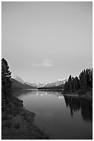 Maligne Lake from the outlet of the Maligne River, blue dusk. Jasper National Park, Canadian Rockies, Alberta, Canada ( black and white)
