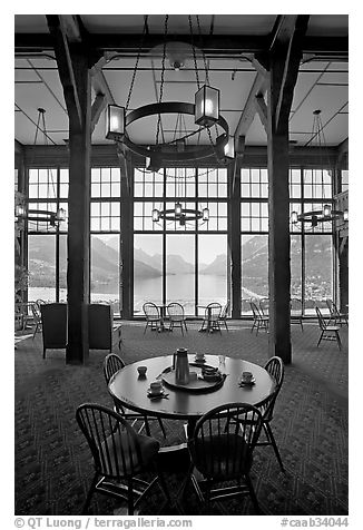 Table in lobby of Prince of Wales hotel with view over Waterton Lake. Waterton Lakes National Park, Alberta, Canada