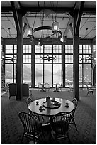 Table in lobby of Prince of Wales hotel with view over Waterton Lake. Waterton Lakes National Park, Alberta, Canada ( black and white)
