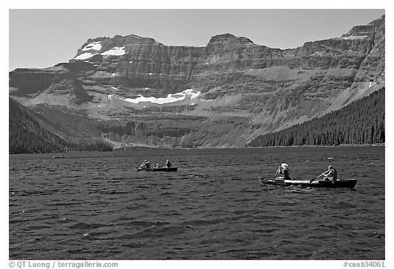 Canoists on Cameron Lake. Waterton Lakes National Park, Alberta, Canada (black and white)