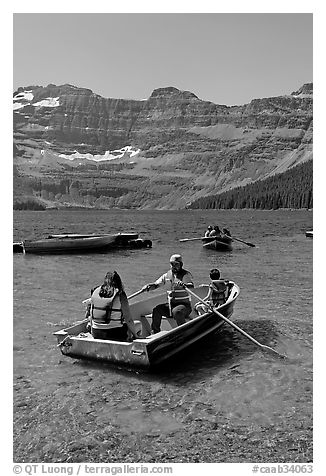 Families boating in Cameron Lake. Waterton Lakes National Park, Alberta, Canada