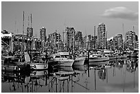 Small boat harbor and skyline at dusk. Vancouver, British Columbia, Canada ( black and white)
