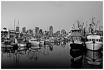 Fishing boats and skyline at dusk. Vancouver, British Columbia, Canada (black and white)