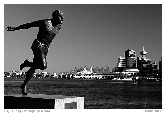 Runner's statue and Harbor center, late afernoon. Vancouver, British Columbia, Canada