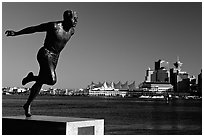 Runner's statue and Harbor center, late afernoon. Vancouver, British Columbia, Canada (black and white)