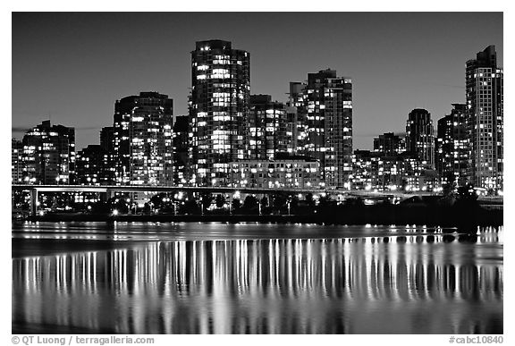 High-rise buildings reflected in False Creek at night. Vancouver, British Columbia, Canada (black and white)