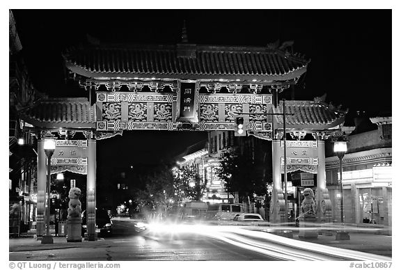 Chinatown gate with trail of lights at night. Victoria, British Columbia, Canada (black and white)