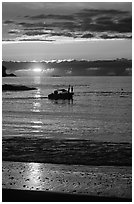 Small boat at Sunset, Half-moon bay. Pacific Rim National Park, Vancouver Island, British Columbia, Canada ( black and white)