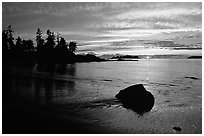 Rock and bay at sunset, Half-moon bay. Pacific Rim National Park, Vancouver Island, British Columbia, Canada ( black and white)
