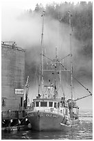Commercial fishing boat and fog, Tofino. Vancouver Island, British Columbia, Canada (black and white)