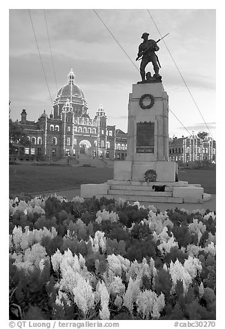 Flowers, memorial, and illuminated parliament. Victoria, British Columbia, Canada (black and white)