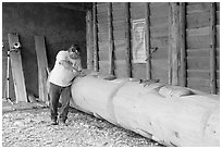 Artist carving a totem pole. Butchart Gardens, Victoria, British Columbia, Canada ( black and white)