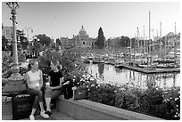Young Women sitting, Inner harbor. Victoria, British Columbia, Canada ( black and white)