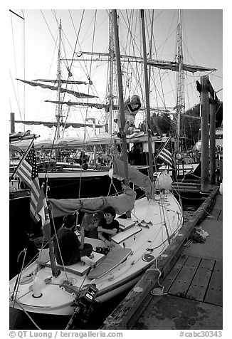Kids in a small sailboat docked in Inner Habor. Victoria, British Columbia, Canada