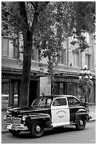 Old Police car in Water Street. Vancouver, British Columbia, Canada ( black and white)