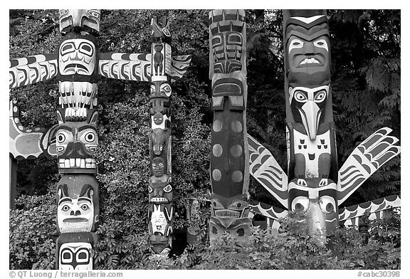 Totem collection near the Capilano bridge. Vancouver, British Columbia, Canada (black and white)