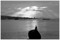 Girl in wetsuit statue, sunrise, Stanley Park. Vancouver, British Columbia, Canada ( black and white)