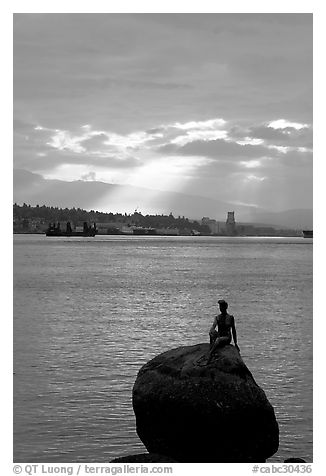 Girl in wetsuit statue, sunrise, Stanley Park. Vancouver, British Columbia, Canada (black and white)