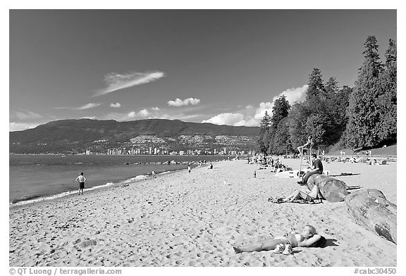 Woman sunning herself on a beach, Stanley Park. Vancouver, British Columbia, Canada (black and white)