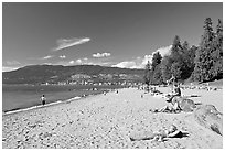 Woman sunning herself on a beach, Stanley Park. Vancouver, British Columbia, Canada ( black and white)
