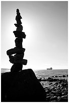 Backlit balanced rocks and ship in the distance. Vancouver, British Columbia, Canada ( black and white)