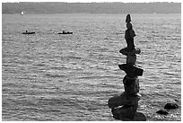 Balanced rocks and kayaks in a distance. Vancouver, British Columbia, Canada ( black and white)
