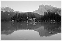 Cabins on the shore of Emerald Lake, with reflected mountains, sunset. Yoho National Park, Canadian Rockies, British Columbia, Canada (black and white)