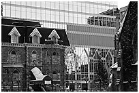 Reflection of an older building in the glass of a modern building, Montreal. Quebec, Canada (black and white)