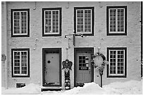 Facade in winter with snow on the curb,  Quebec City. Quebec, Canada (black and white)
