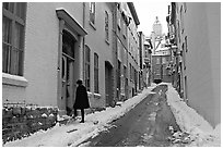 Narrow street partly covered with snow, Quebec City. Quebec, Canada (black and white)