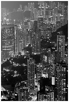 Residential towers on steep hillside from Victoria Peak by night. Hong-Kong, China ( black and white)