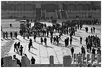 Crowd of tourists in the Sea of Flagstone (court of the imperial palace), Forbidden City. Beijing, China ( black and white)