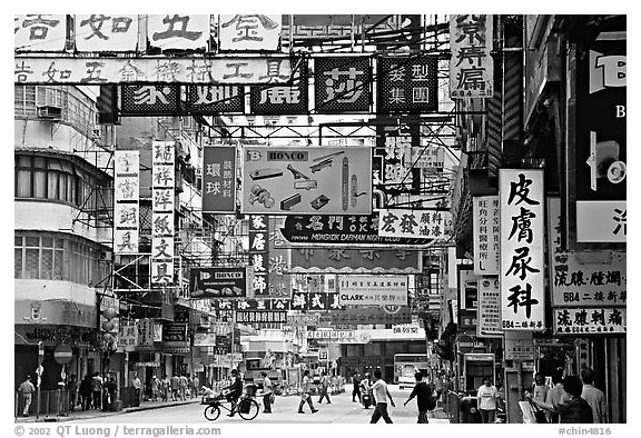 Street in Kowloon with signs in Chinese. Hong-Kong, China (black and white)