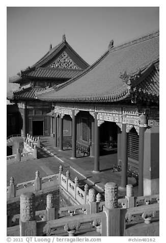 Pavilion with red columns and yellow roof tiles typical of imperial architecture, Forbidden City. Beijing, China (black and white)