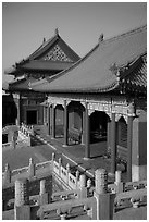 Pavilion with red columns and yellow roof tiles typical of imperial architecture, Forbidden City. Beijing, China ( black and white)