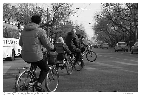 Bicyles and cyclo on street. Beijing, China