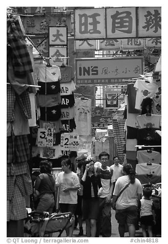 Crowded alley with clothing vendors, Kowloon. Hong-Kong, China (black and white)