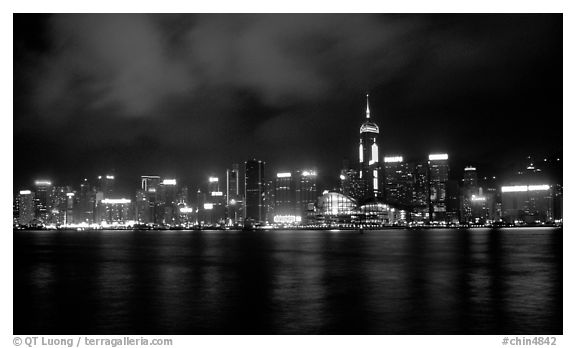 Colorful reflexions of Hong-Kong Island lights across the harbor by night. Hong-Kong, China