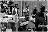 Women of the Bai tribe selling incense. Shaping, Yunnan, China (black and white)