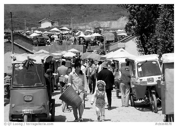 Tuk-tuk waiting for villagers ouside the Monday market. Shaping, Yunnan, China (black and white)