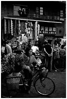 Flower peddler in an old alley. Kunming, Yunnan, China ( black and white)
