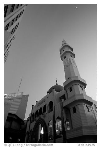 Nancheng Mosque built recently, a hybrid of white-tiled high rise with a mosque's green onion domes. Kunming, Yunnan, China (black and white)