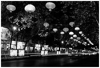 Zhengyi Lu illuminated by lanterns at night. Kunming, Yunnan, China (black and white)