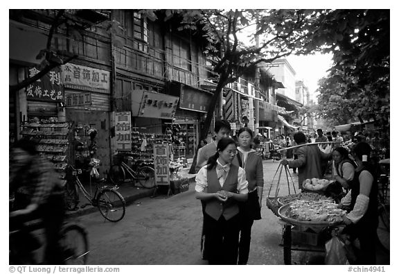 Street vendors in an old street. Kunming, Yunnan, China