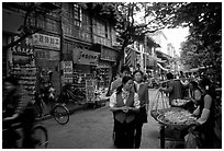 Street vendors in an old street. Kunming, Yunnan, China ( black and white)