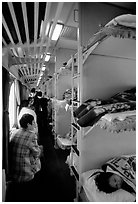 Inside a hard sleeper car train. (black and white)