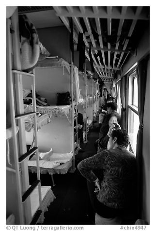 Inside a hard sleeper car train.  (black and white)