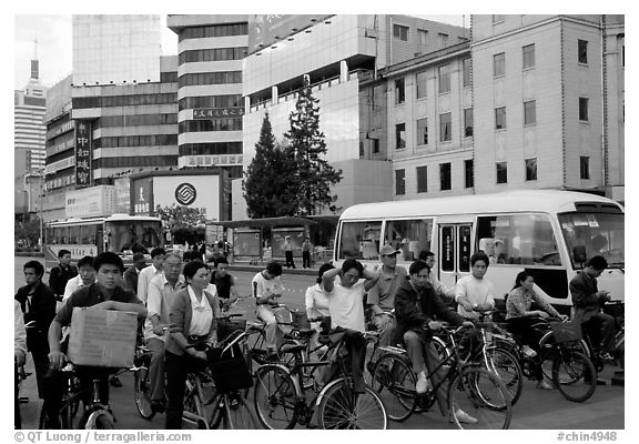 Bicyclists waiting for traffic light. Kunming, Yunnan, China (black and white)