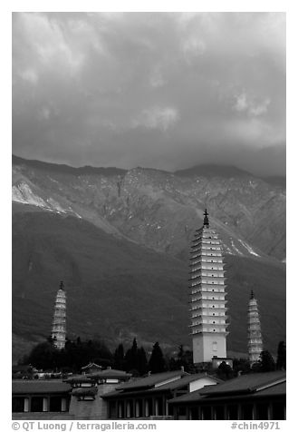 San Ta Si (Three pagodas) at sunrise with Cang Shan mountains in the background. Dali, Yunnan, China (black and white)
